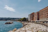 Kaboompics - Naples Waterfront Rocks and Colorful Buildings Along the Bay