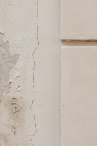 Kaboompics - White Stucco Wall with Vertical Crack and Architectural Trim