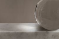 Kaboompics - Large Clear Sphere on Marble Surface
