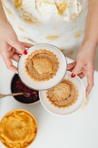Kaboompics - Two Decorative Pumpkin Pies Served on White Plates