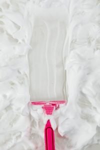 White Shaving Foam Texture Backgrounds with Pink Razor Details