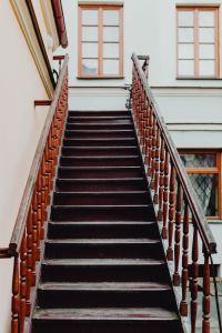 Kaboompics - Dark Wooden Staircase in Zamość Courtyard
