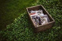 Kaboompics - Wooden Box of Vintage Photos on Green Grass
