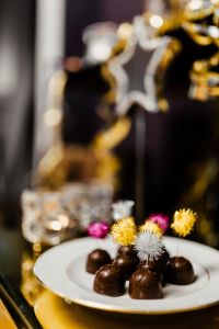 Kaboompics - New Year's Eve Chocolate Pralines with Star Decor and Crystal Candleholder