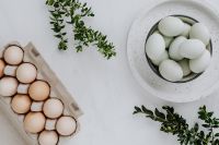 Kaboompics - Easter flat lay with green eggs on a white marble