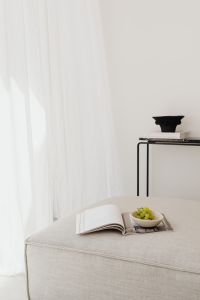 Kaboompics - Bright Living Room with Linen Sofa, Magazine and Grapes