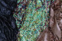 Kaboompics - Blue, Multicolor and Bronze Sequin Fabrics Side by Side, Textile Swatch Background