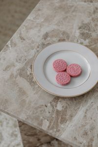 Kaboompics - Pink Cookies on a White Plate over Marble