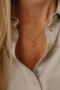 Kaboompics - Gold Pendant Necklace and Silk Shirt Details