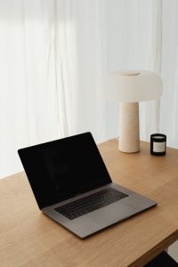 Kaboompics - Travertine Desk Lamp and Laptop by a White Curtain