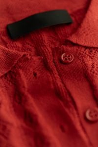 Kaboompics - Detailed View of Red Knitted Top and Collar
