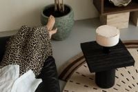 Kaboompics - Woman Relaxing in Leopard Print Skirt in Modern Living Room