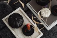 Kaboompics - Black Pumpkin and Red Candle on Tray