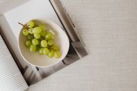 Kaboompics - Minimalist Grapes and Magazine Still Life with Copy Space