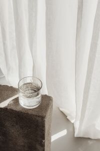 Kaboompics - Sunlit Drinking Glass With Soft Curtain Shadows