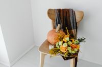 Kaboompics - Pumpkin and Autumn Flower Arrangement on a Chair