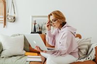 Kaboompics - Woman Wearing Glasses and Using Laptop at Home
