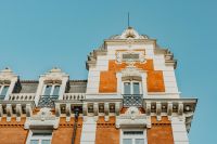 Kaboompics - Madrid Red Brick and White Stone Rooftop Facade with Decorative Finial