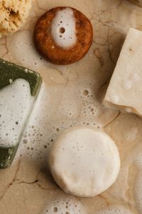Kaboompics - Top View of Colorful Natural Soap Bars and Sea Sponges