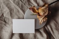 Kaboompics - Top-Down Card Mockup beside Dried Flower and Soft Linen Background