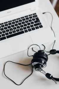 Kaboompics - White laptop with smartphone and headphones