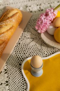 Kaboompics - Rustic Easter Breakfast Detail with Baguette, Hyacinth and Egg Cup