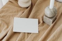 Kaboompics - Neutral Stationery Mockup with Blank Card, Ceramic Vase and Stone Candleholder