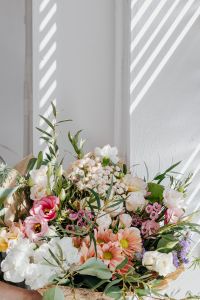 Kaboompics - Pastel Floral Bouquet beneath Diagonal Window Light, Vertical Copy Space Background