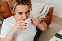 Kaboompics - Woman drinks coffee