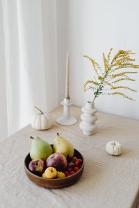 Kaboompics - Vertical Autumn Table Decor with White Pumpkins, Goldenrod, Candle and Mixed Fruit