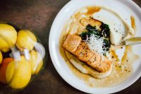 Kaboompics - Bourbon Glazed Salmon with Spinach and Potato beside Fresh Lemons