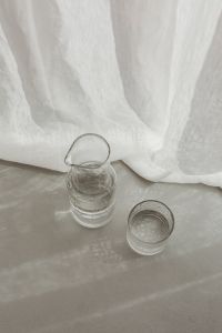 Kaboompics - Top-Down Glass Jug and Tumbler With Soft Curtain Shadows