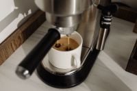 Kaboompics - Espresso Pouring into a White Ceramic Mug