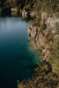 Kaboompics - Steep Limestone Cliff Along Dark Blue Water