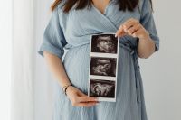 Kaboompics - Pregnant Woman Reclining and Holding Her Pregnant Belly