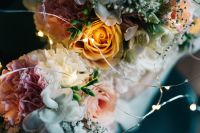 Kaboompics - Bouquet of flowers in a bag with some fairy lights