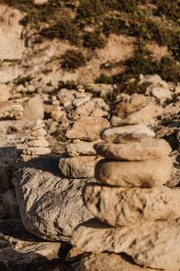 Kaboompics - Multiple Stone Cairns on a Rocky Shore