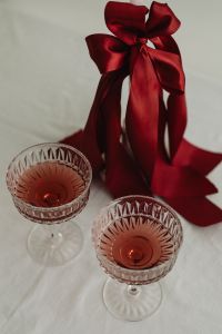 Kaboompics - Red Satin Bow and Pink Cocktails on a White Valentine Table