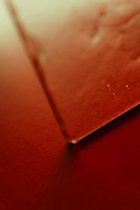 Kaboompics - Glass and Red Paper Macro Abstract Background