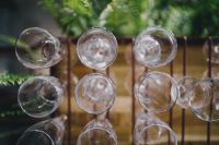 Kaboompics - A big bunch of wine glasses hanging from a holder