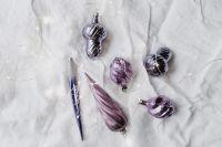 Kaboompics - Violet Christmas Ornaments and Silver Pen on White Background