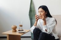 Kaboompics - Woman Sipping Coffee in a Calm Living Room