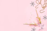 Kaboompics - Pink New Years Wallpaper with Champagne Glass and Snowflakes