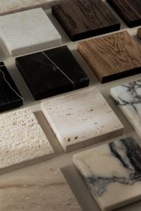Kaboompics - Black Marble, Wood and Travertine Samples in a Neutral Material Flat Lay