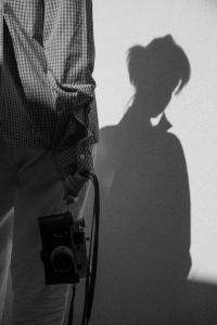 Kaboompics - Photographer Shadow Holding Vintage Camera