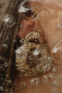 Kaboompics - Gold Jewelry Macro on Skin with Wet Glass Effect