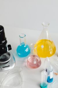 Kaboompics - Colorful Chemistry Flasks Beside Microscope