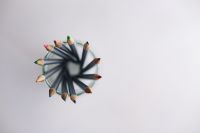 Kaboompics - Overhead Close-Up of Sharpened Colored Pencils Arranged in a Circle inside a Glass Jar