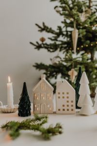 Kaboompics - White Christmas Village with Candles and Evergreen Branches