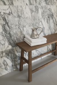 Kaboompics - Wooden Bench with Silver Pitcher and Towels on Arabescato Wall